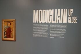 View of a self-portrait by Modigliani at start of exhibition